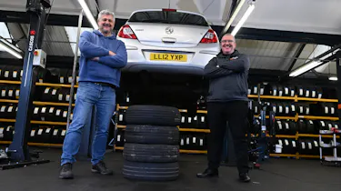 Auto Express consumer editor Chris Rosamond and Protyre area manager Simon Hall standing next to a vehicle inspection ramp