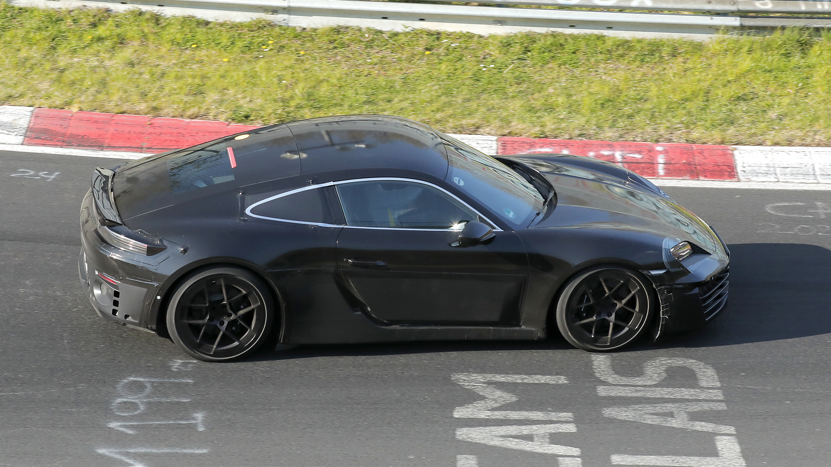 Porsche Cayman EV at Nurburgring (camouflaged) - side