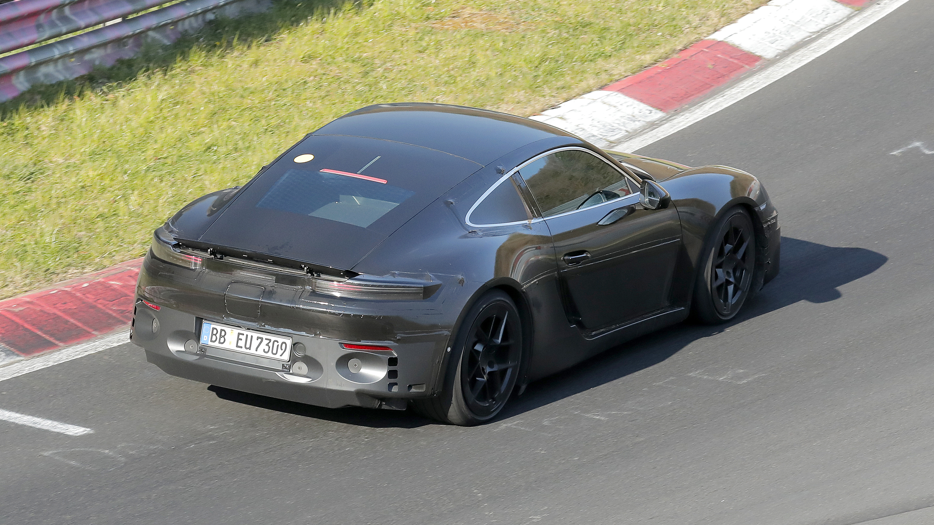 Porsche Cayman EV at Nurburgring (camouflaged) - rear cornering