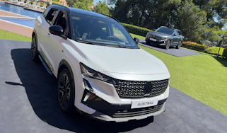 Renault Austral - White front overhead with grey in the background