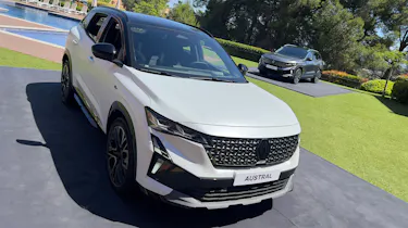 Renault Austral - White front overhead with grey in the background