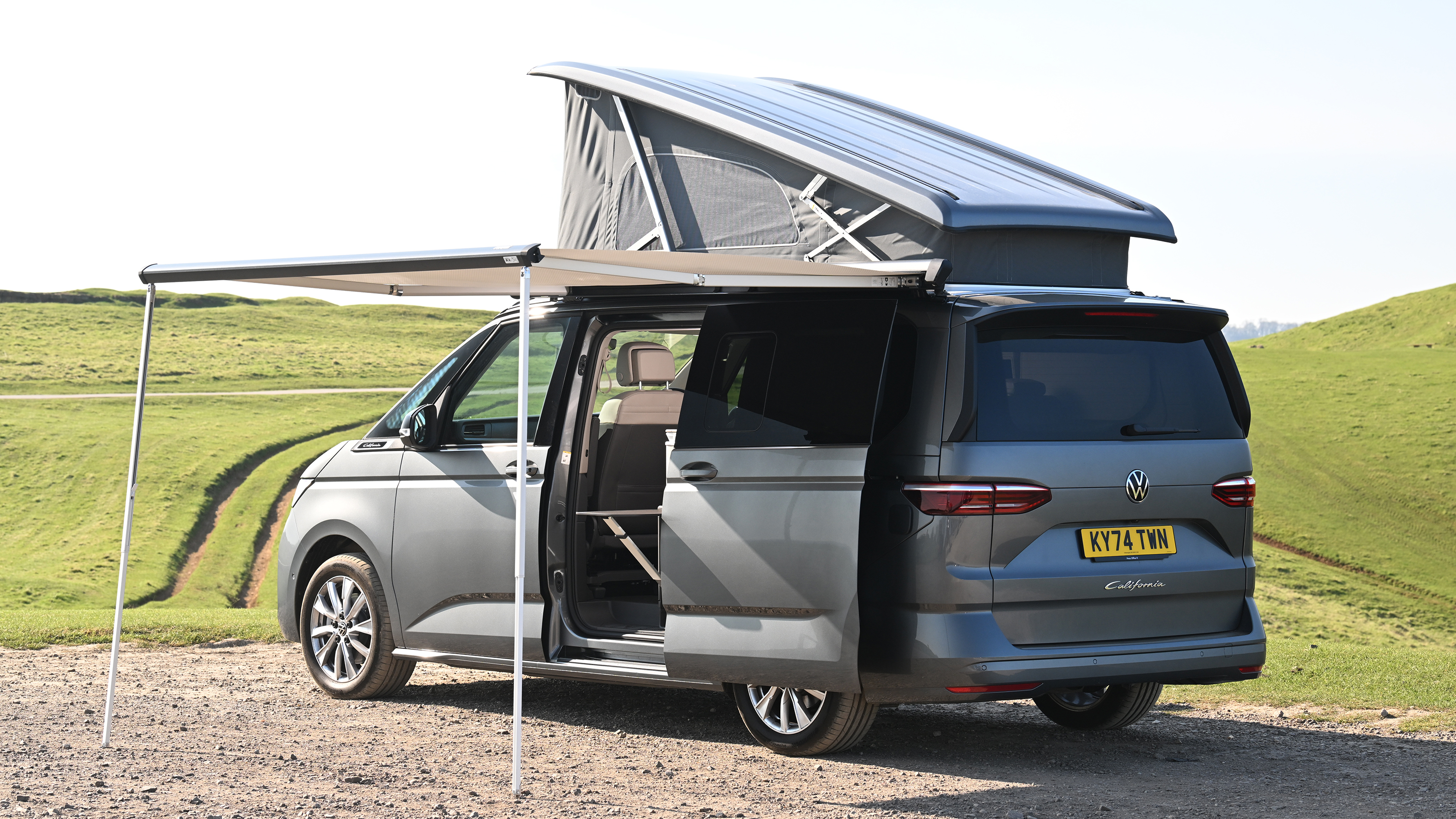 Volkswagen California - rear static with roof tent and awning up 