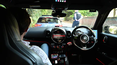Auto Express consumer reporter Tom Jervis sitting in a police car