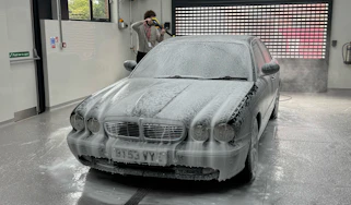 Autoglym Car Care Experience Day - front of Jaguar being cleaned