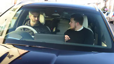Richard having a conversation while driving