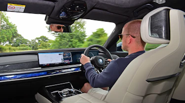 Auto Express chief reviewer Alex Ingram driving the BMW i7