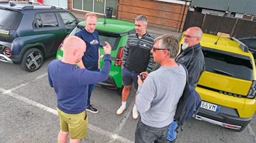 Auto Express team standing in front of a trio of EVs