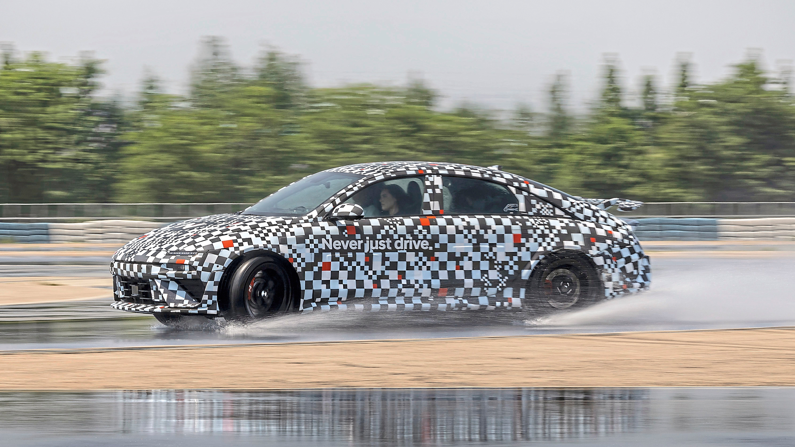 Hyundai Ioniq 6 N prototype - side action (wet)