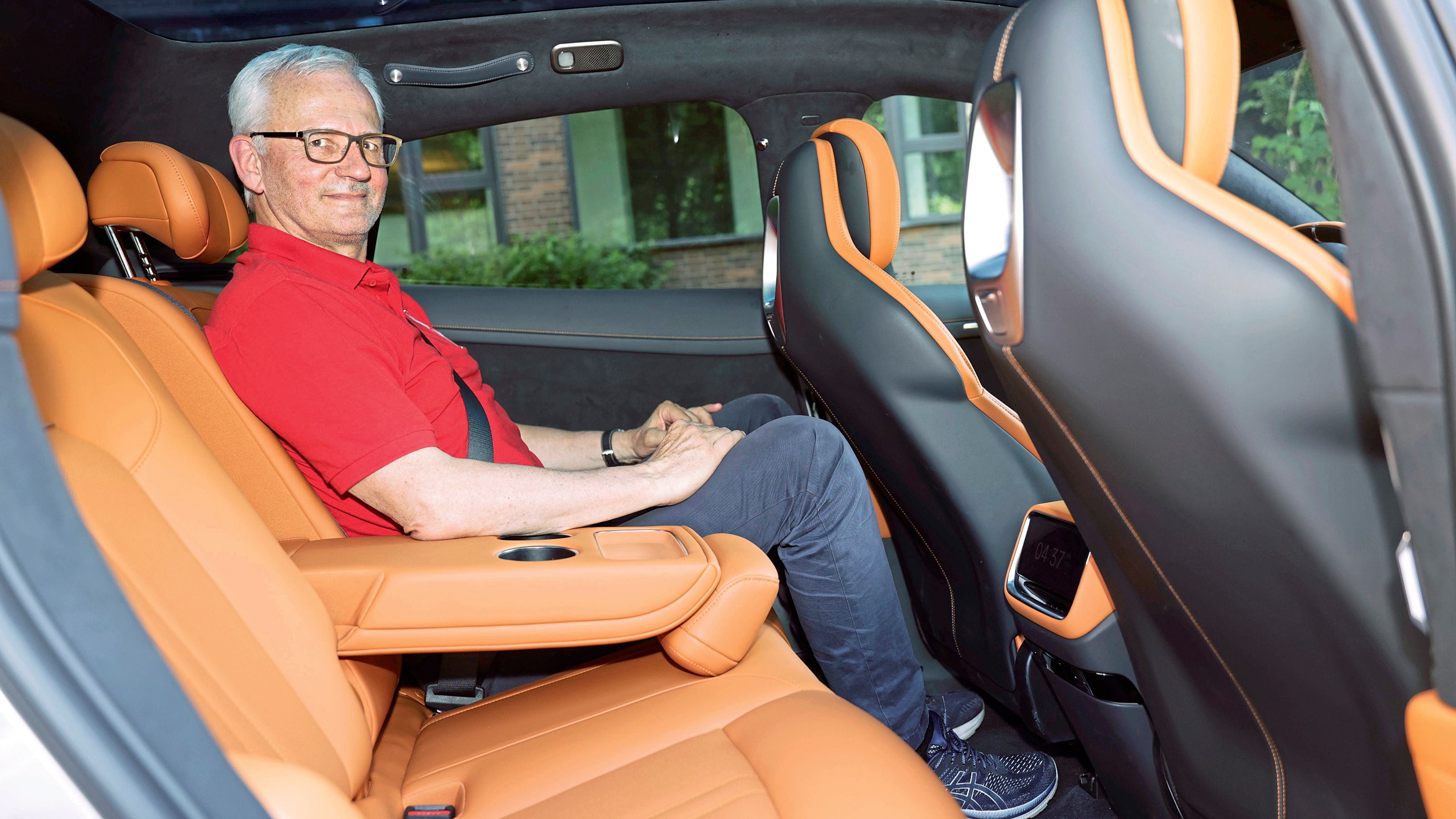 Dirk Branke sitting in the Xiaomi YU7's rear seat
