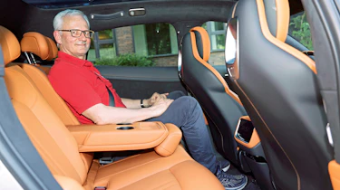 Dirk Branke sitting in the Xiaomi YU7's rear seat