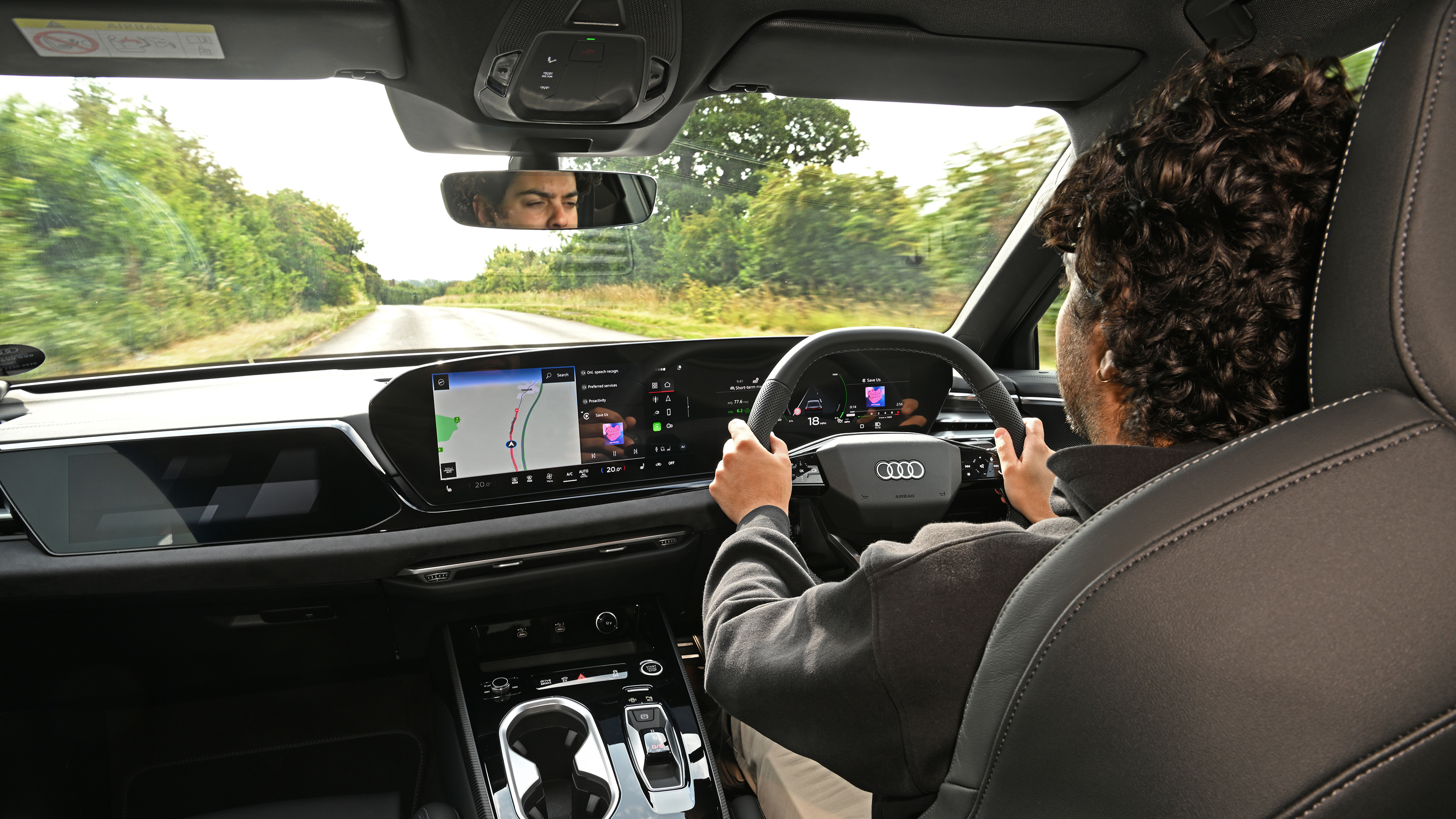 Auto Express senior news editor Jordan Katsianis driving Audi A6 e-Hybrid