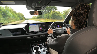 Auto Express senior news editor Jordan Katsianis driving Audi A6 e-Hybrid