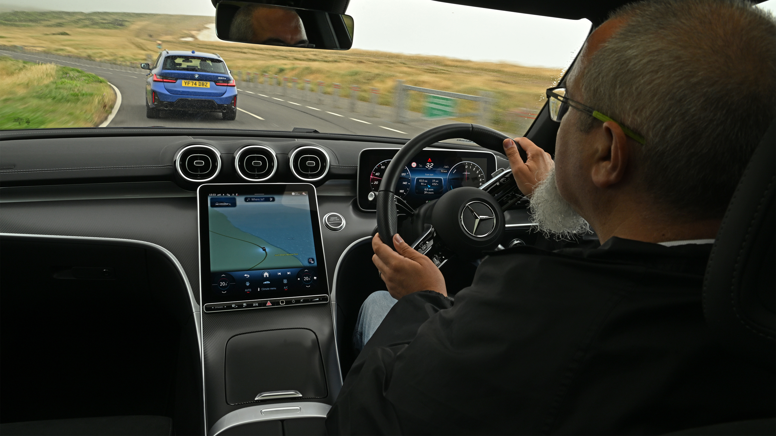 Auto Express senior test editor Dean Gibson driving the Mercedes C 300 e Estate