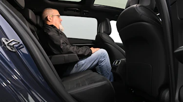 Auto Express senior test editor Dean Gibson sitting in the Mercedes C 300 estate's rear seat