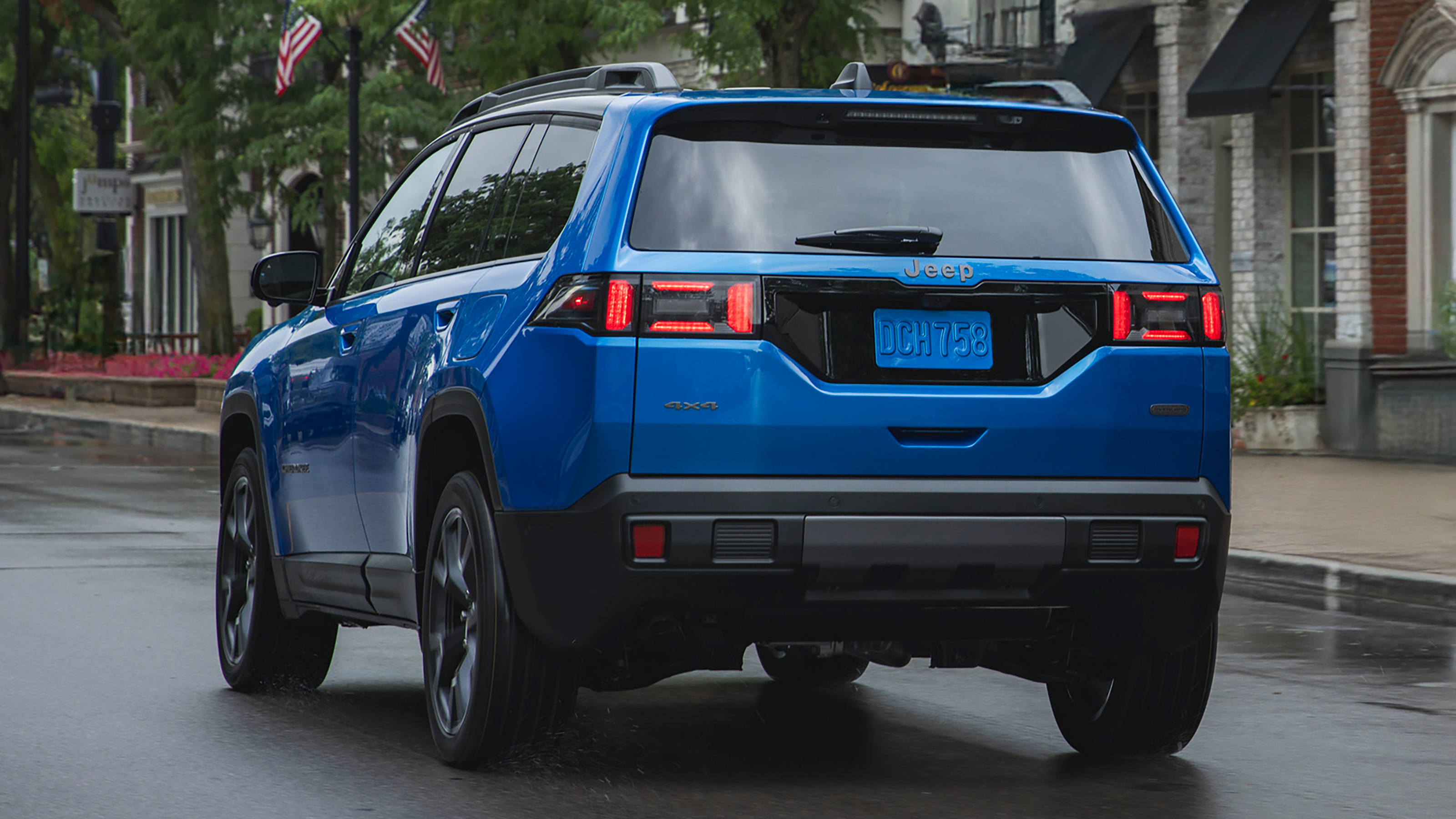 New Jeep Cherokee - blue dynamic rear 3/4 in the wet