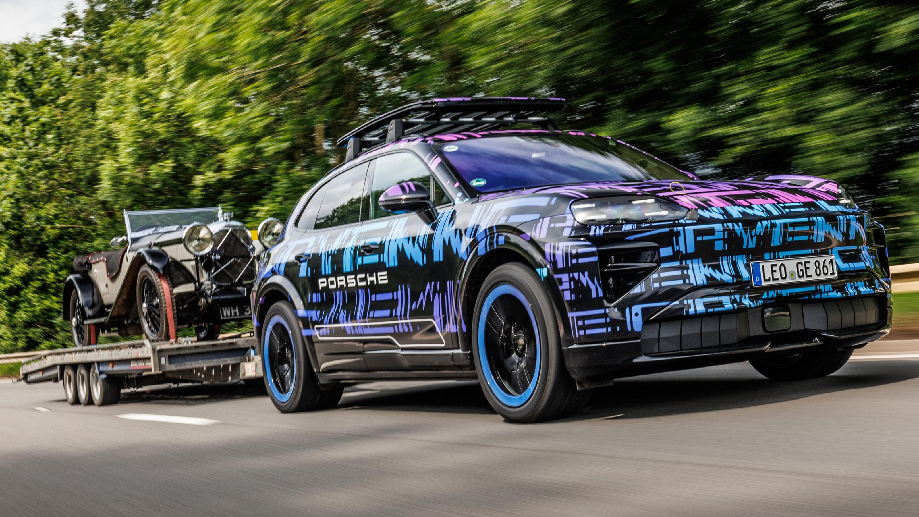 Porsche Cayenne Electric - front 3_4 towing a vintage car