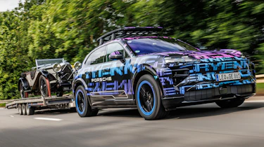 Porsche Cayenne Electric - front 3_4 towing a vintage car