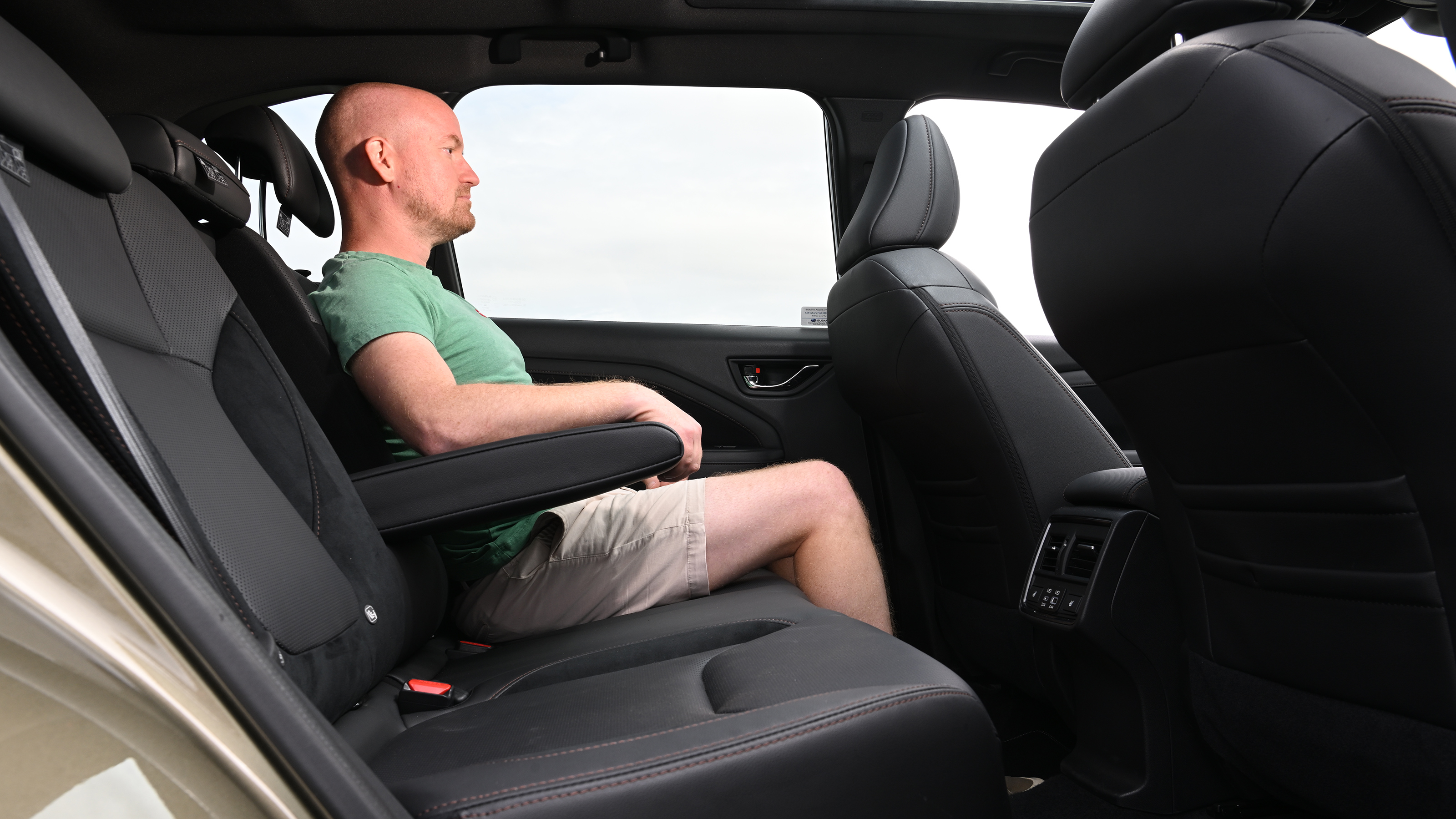 Auto Express chief reviewer Alex Ingram sitting in the Subaru Forester's back seat