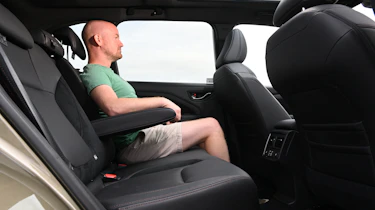 Auto Express chief reviewer Alex Ingram sitting in the Subaru Forester's back seat