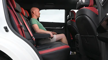 Auto Express chief reviewer sitting in the KGM Actyon's rear seat