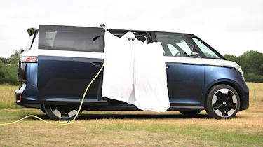 Auto Express head of digital content Steve Walker dressed as a ghost while standing in the Volkswagen ID. Buzz LWB
