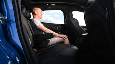 Auto Express contributor Alex Ingram sitting in the Aston Martin DBX S's rear seat