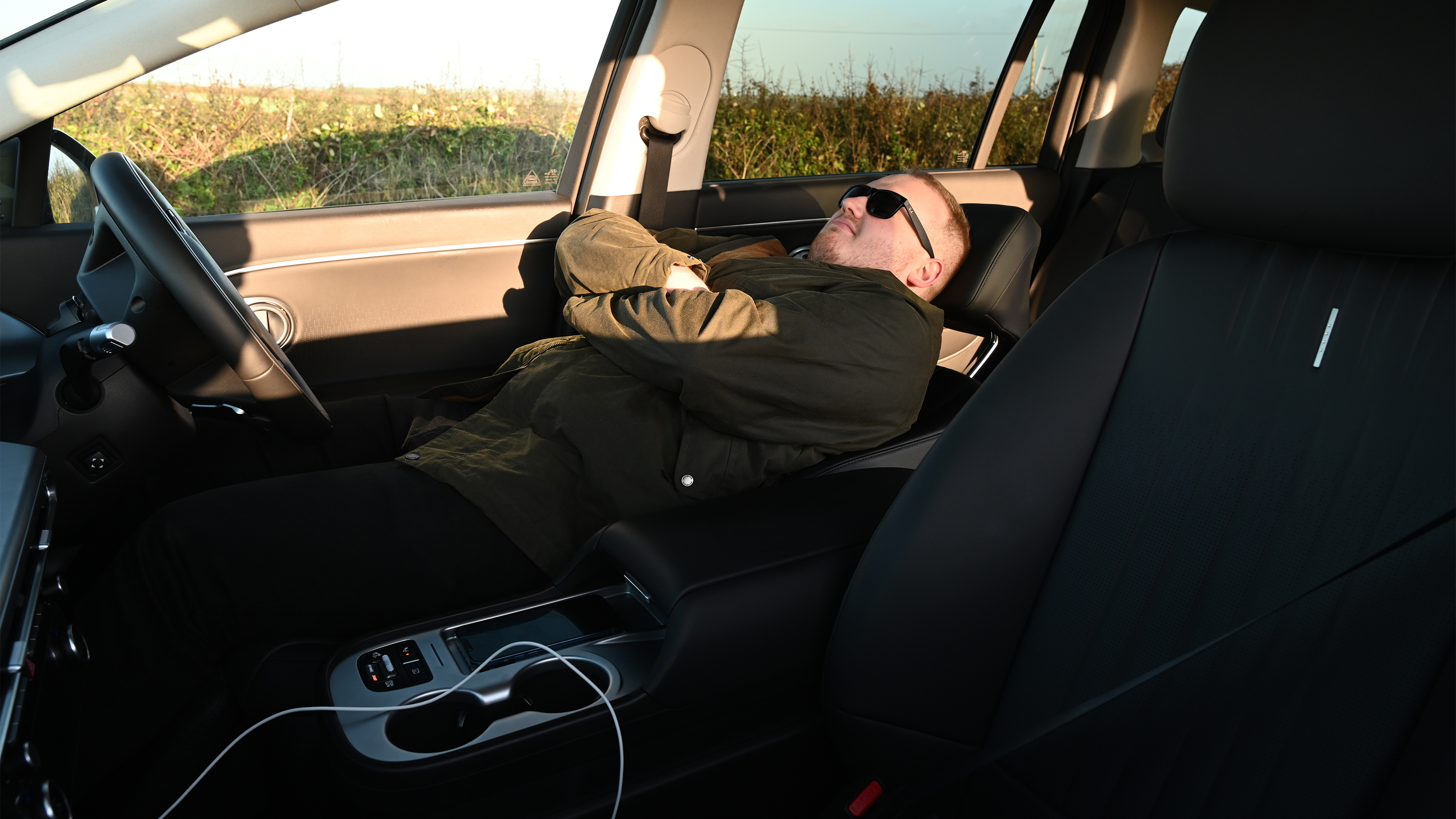 EV tow test - Ellis lying down in the Hyundai