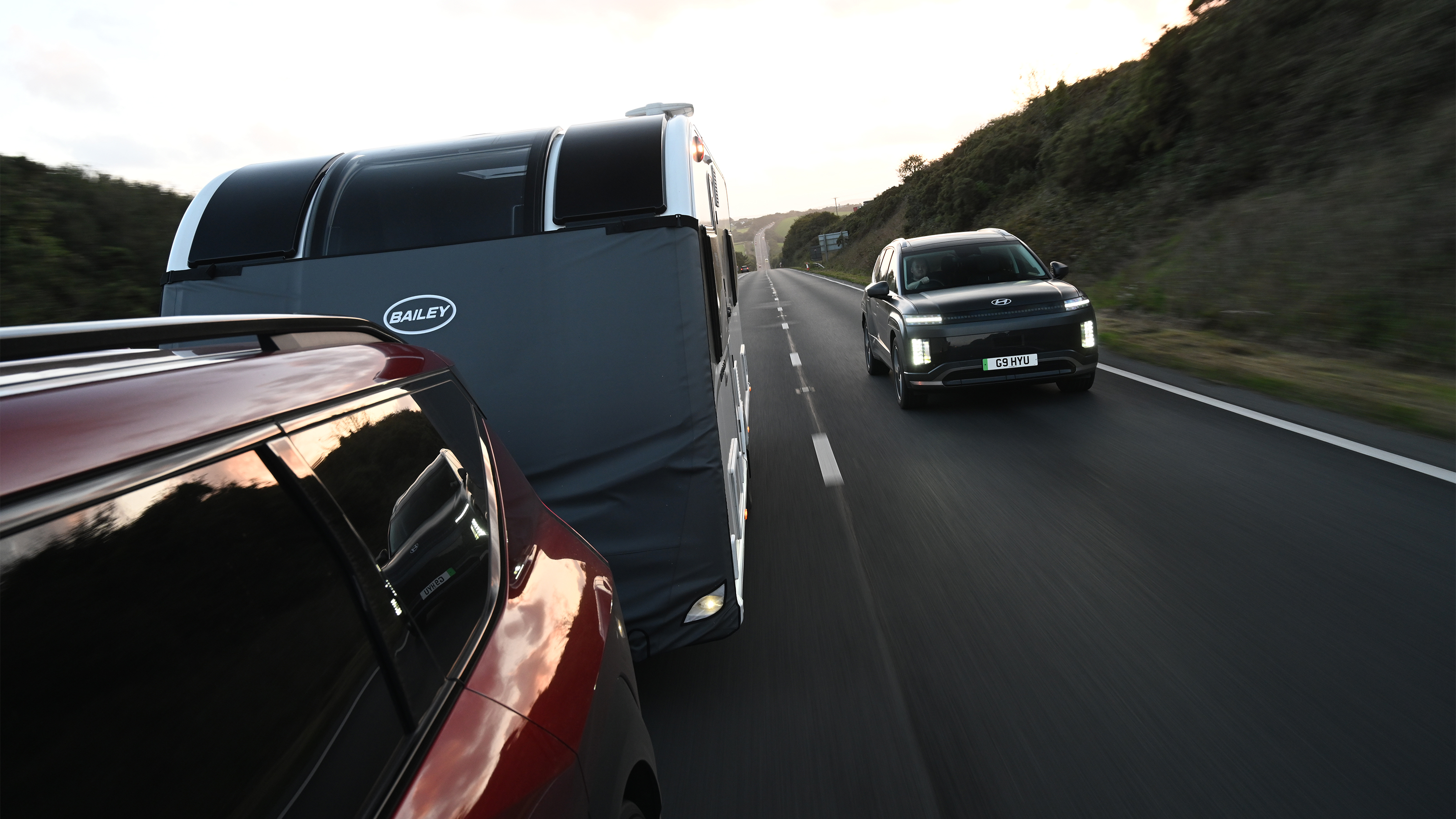 EV tow test - Hyundai following Kia and caravan