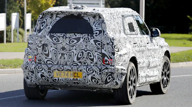 New Land Rover Defender Sport spy shot - rear tracking