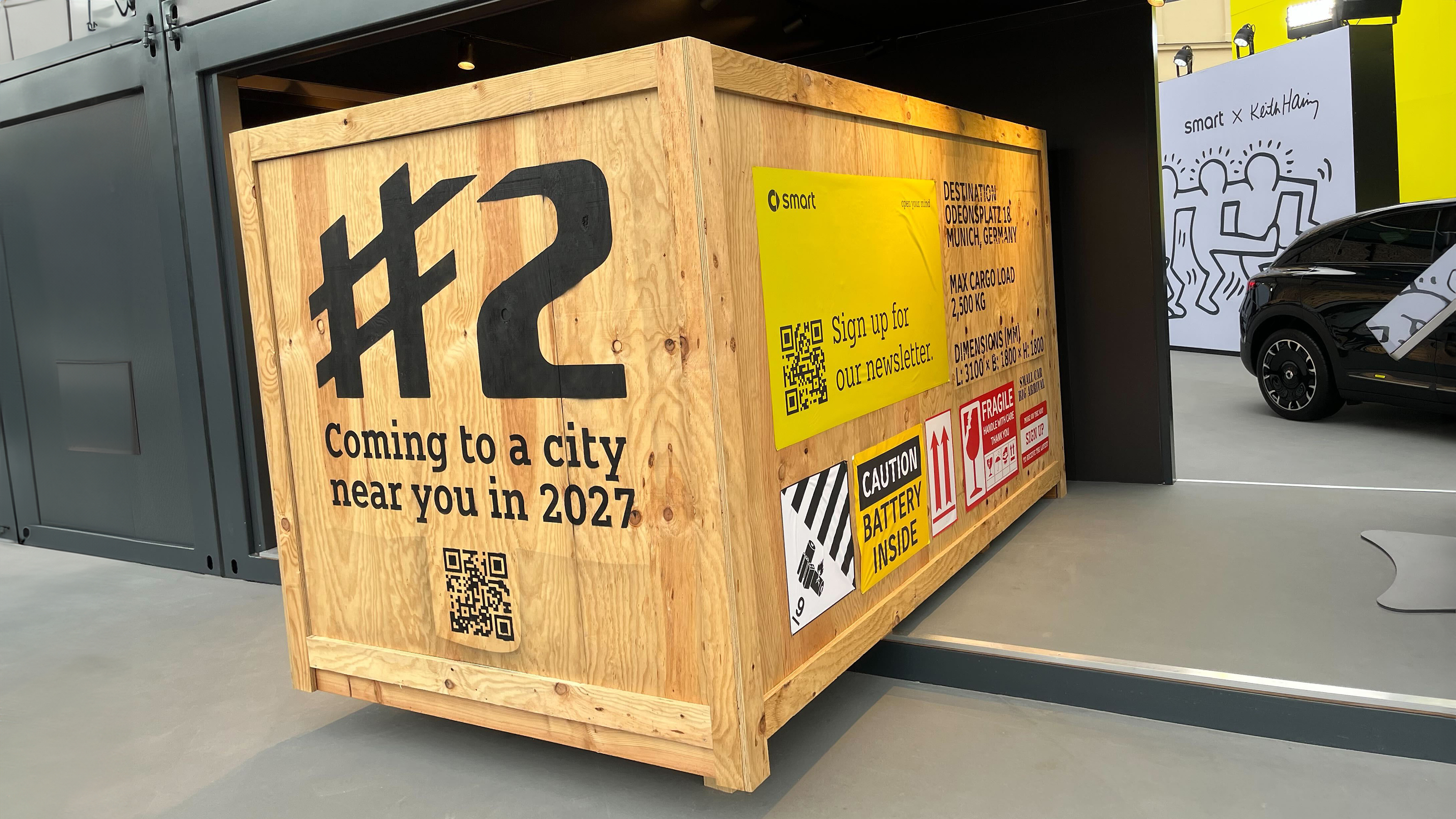 New Smart #2 teaser from Munich Motor Show 2025 - front, in a wooden crate 