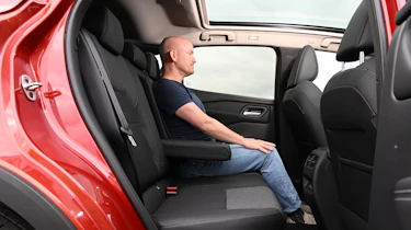 Nissan Qashqai e-Power - rear seats being sat in by Auto Express chief reviewer Alex Ingram