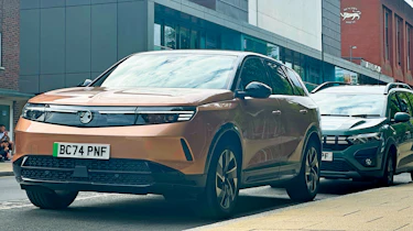 Vauxhall Grandland Electric GS long-term - front 3/4 with a Dacia