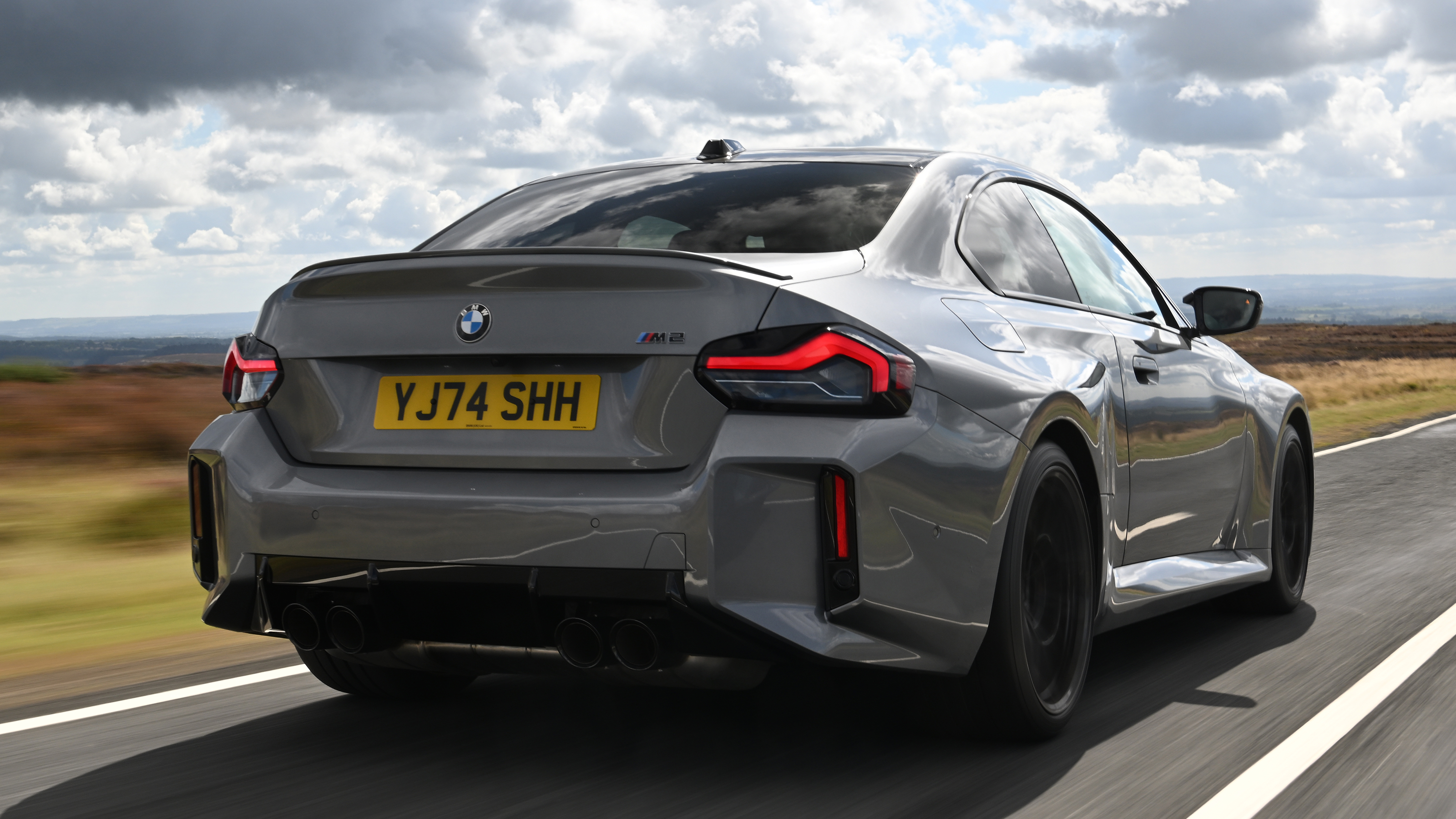 New BMW M2 being driven in the UK - rear tracking 