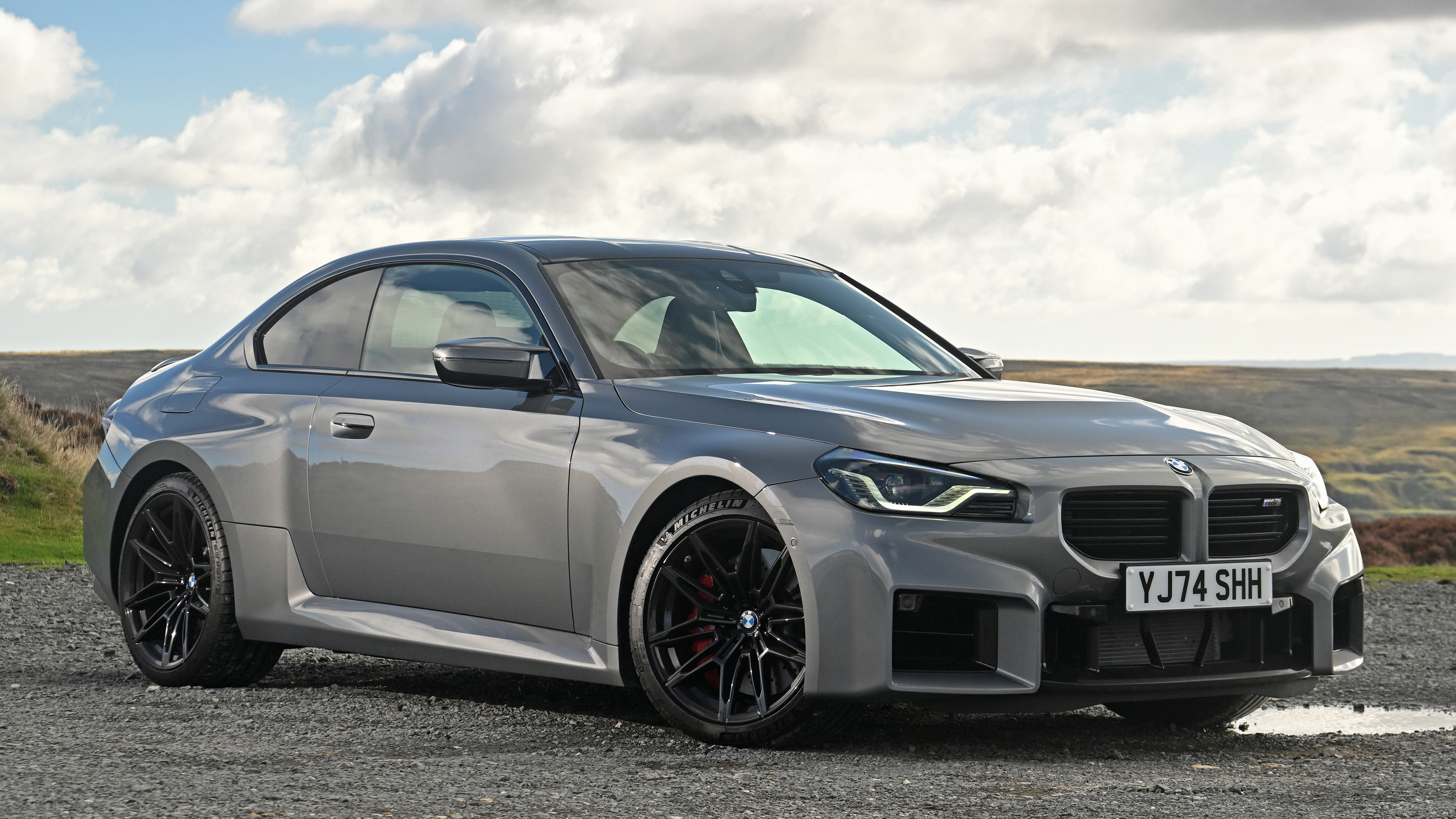 New BMW M2 being driven in the UK - front static 