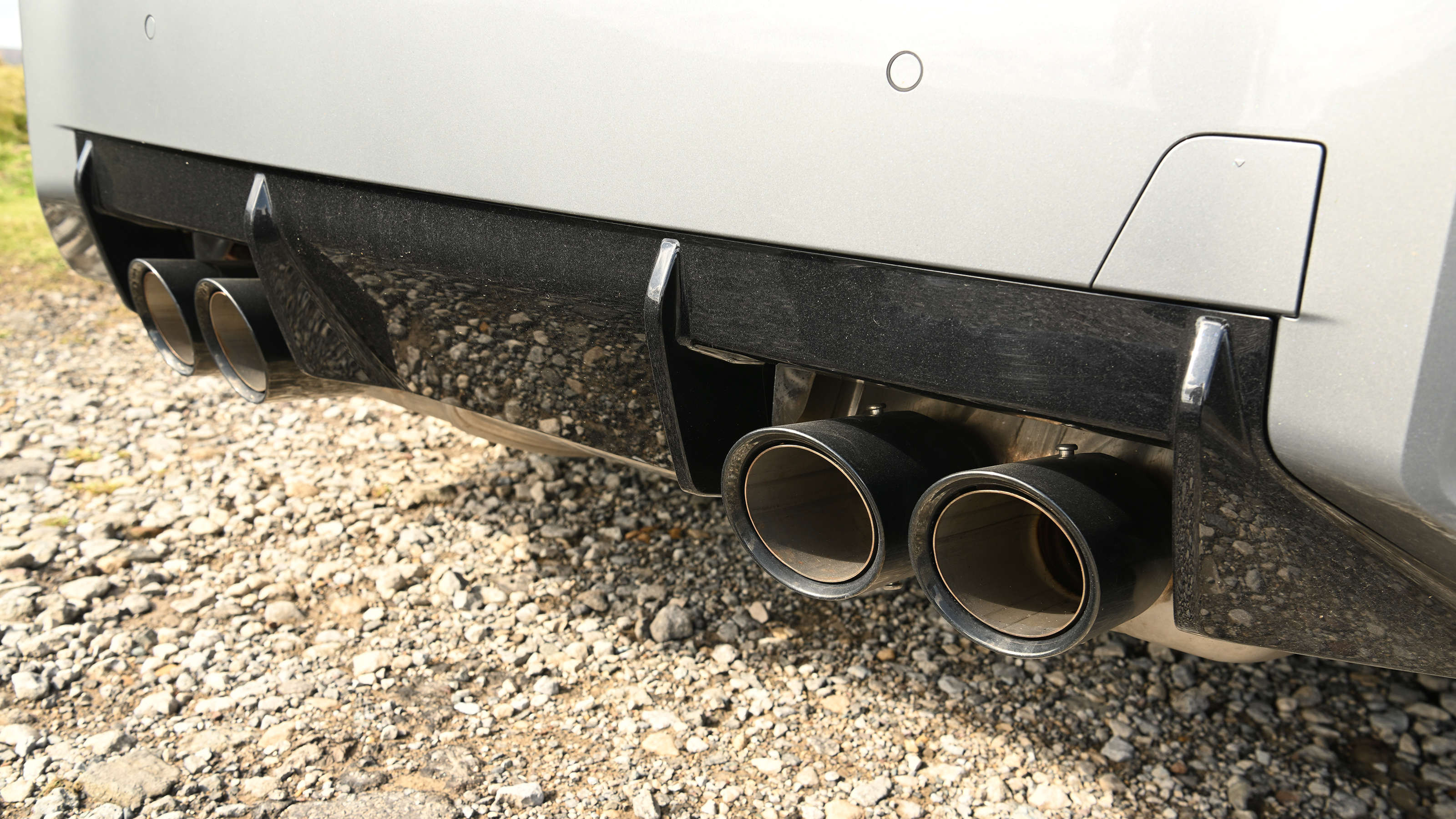 New BMW M2 being driven in the UK - exhaust pipes