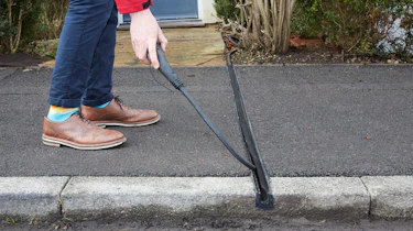 Cross-pavement EV charging solution