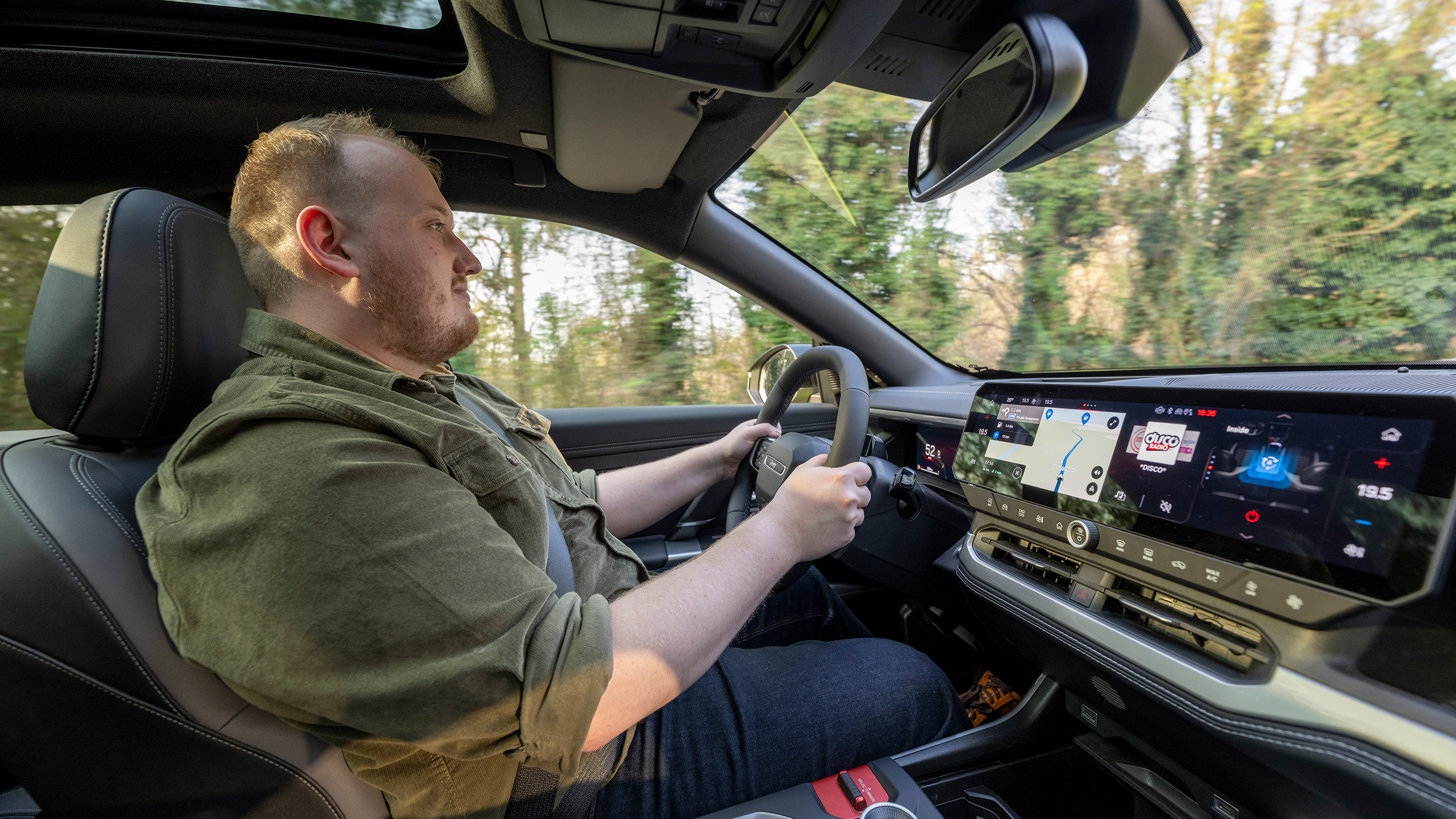 Auto Express news reporter Ellis Hyde driving the Jeep Compass