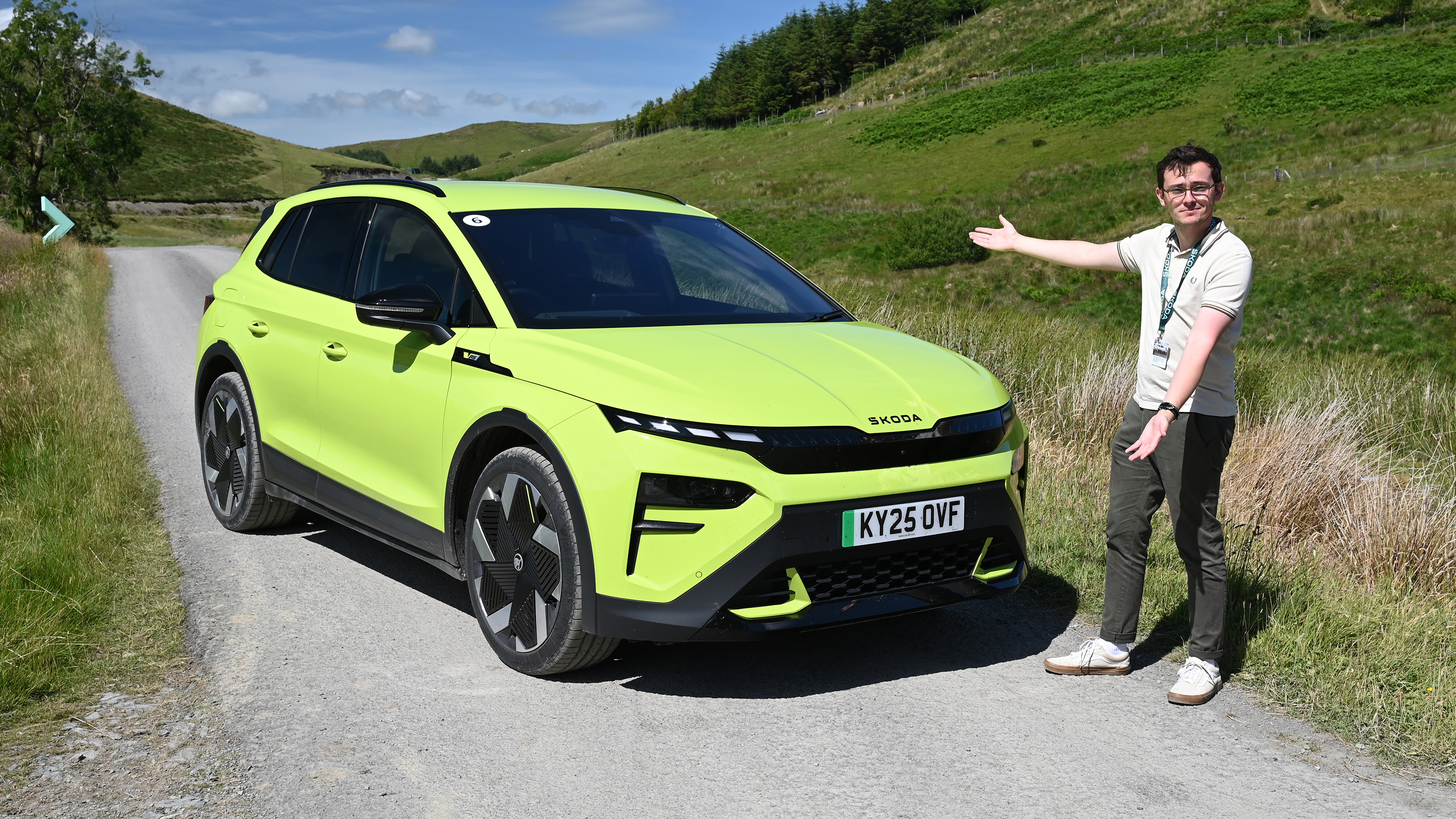 Auto Express consumer reporter Tom Jervis standing next to a Skoda Elroq vRS