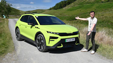 Auto Express consumer reporter Tom Jervis standing next to a Skoda Elroq vRS