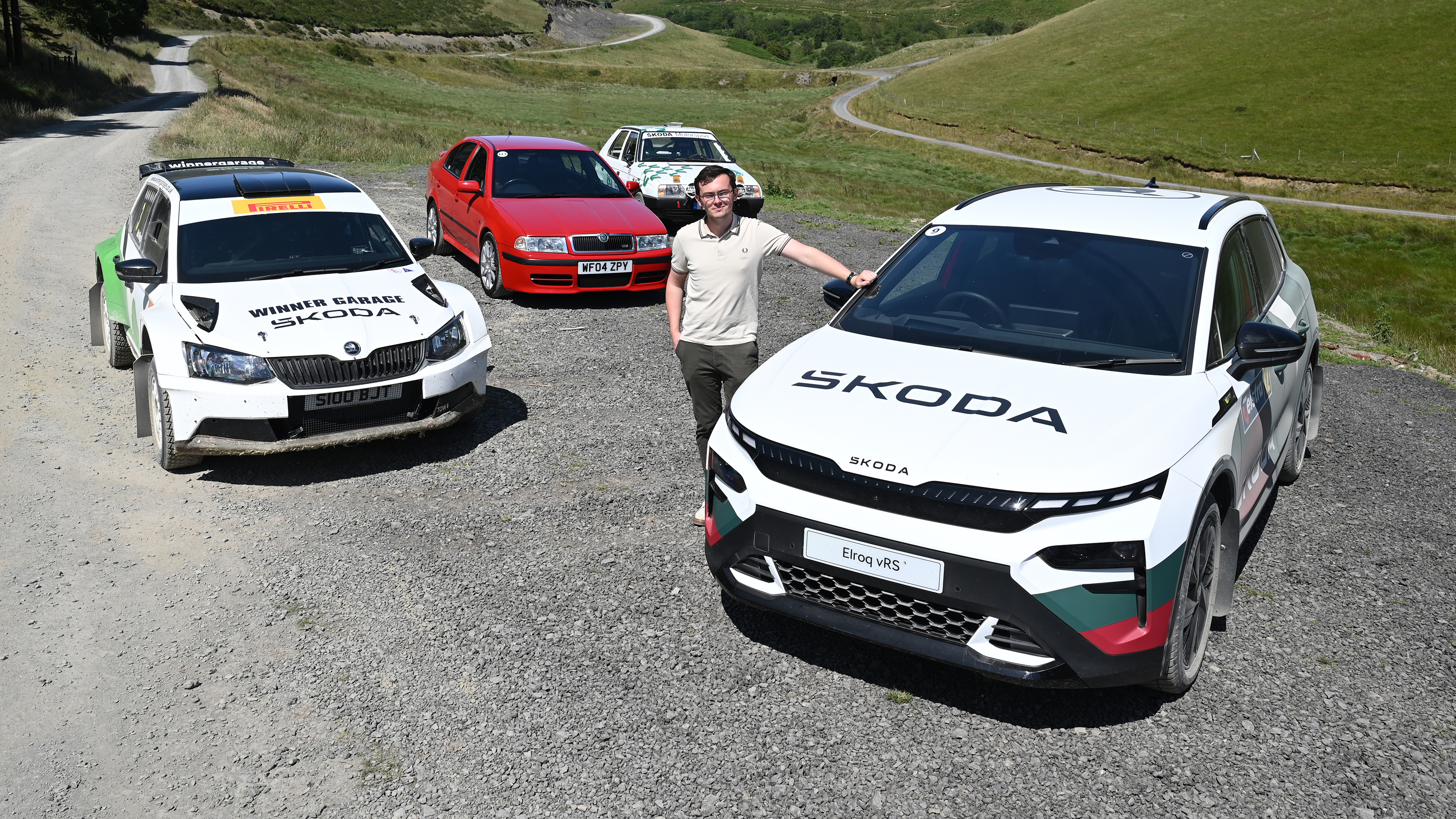 Auto Express consumer reporter Tom Jervis standing with a selection of Skoda vRS cars