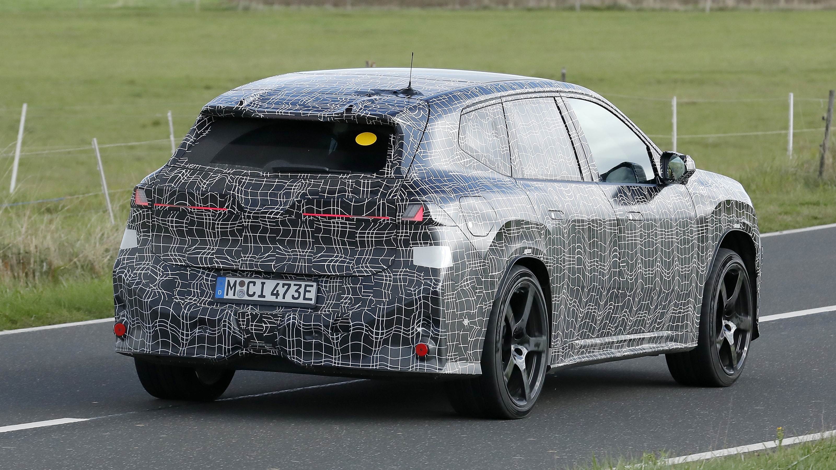 BMW iX3 M - dynamic rear 3/4