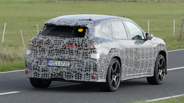 BMW iX3 M - dynamic rear 3/4