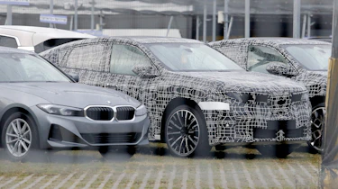 BMW iX4 - front 3/4 parked