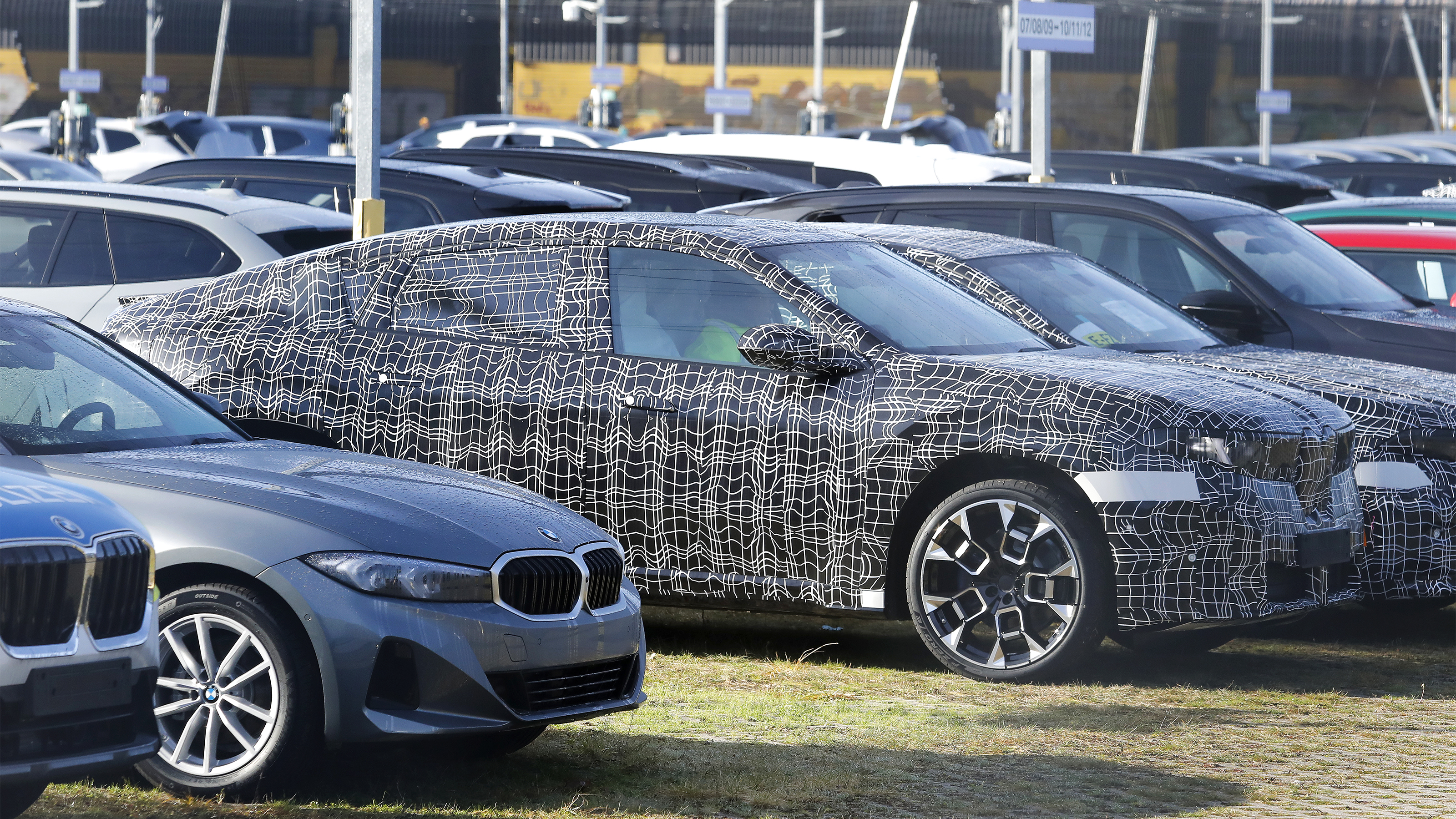 BMW iX4 - front angled parked