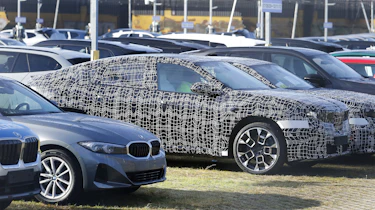 BMW iX4 - front angled parked