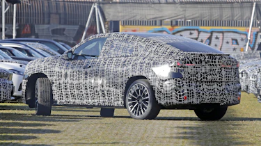 BMW iX4 - rear angled