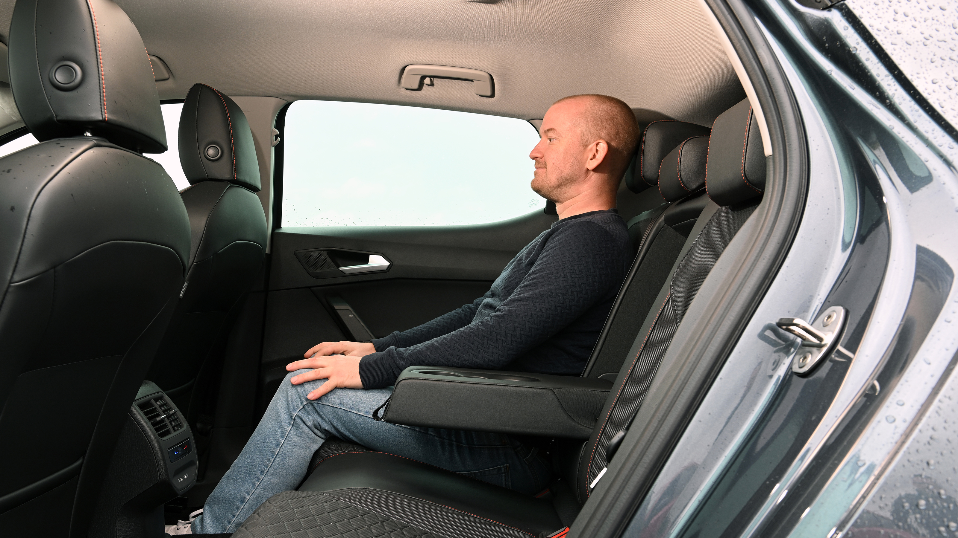 Auto Express chief reviewer Alex Ingram sitting in the SEAT Leon's back seat