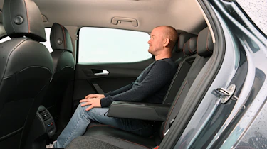 Auto Express chief reviewer Alex Ingram sitting in the SEAT Leon's back seat