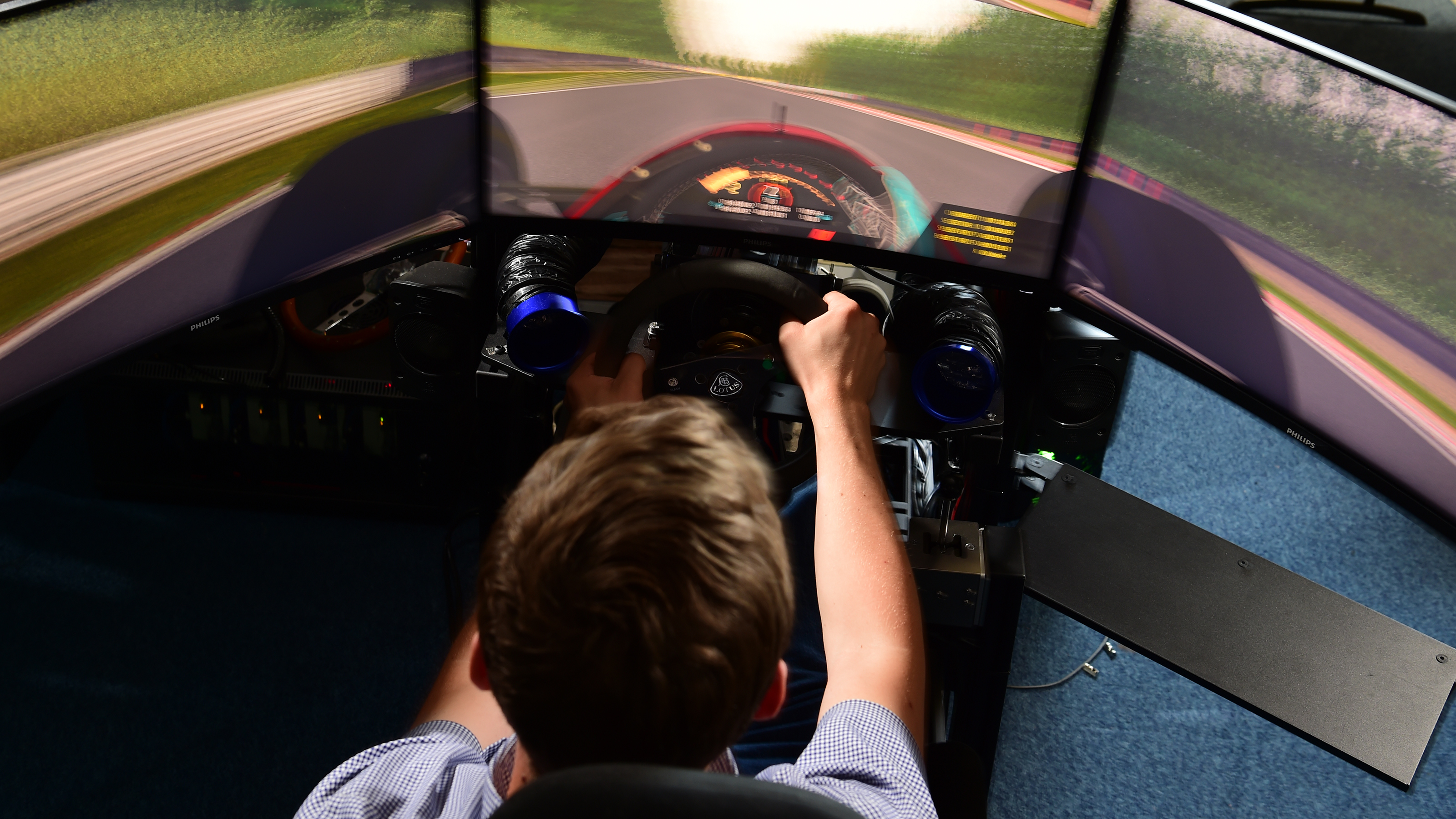 Auto Express consumer reporter Tom Jervis using a sim racing rig