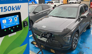 Hyundai Kona Electric connected to rapid charger